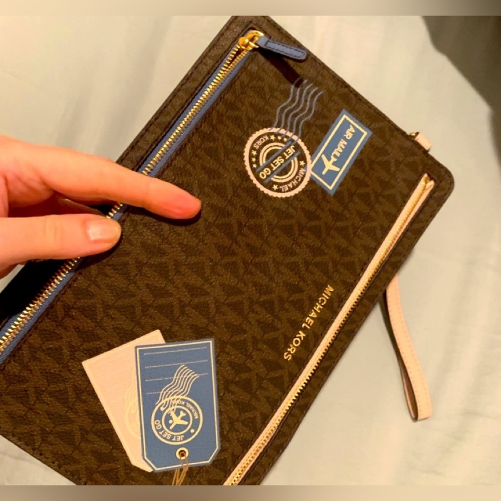 Brand new, limited edition,rare/collective authentic Michael Kors travel pouch.